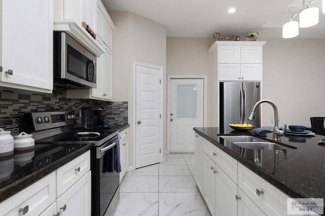 1903 W Webster Dr, Edinburg, TX 78542 - kitchen featuring stainless steel appliances, light marble finish flooring, white cabinetry, dark stone countertops, and recessed lighting