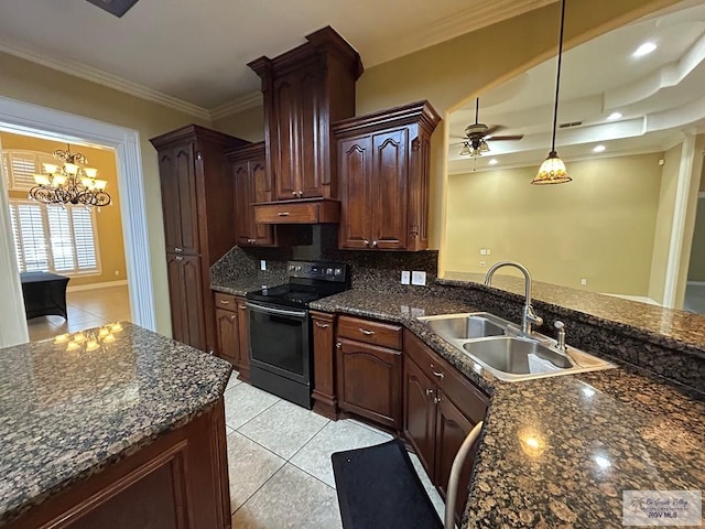 kitchen featuring pendant lighting, sink, crown molding, backsplash, and electric range