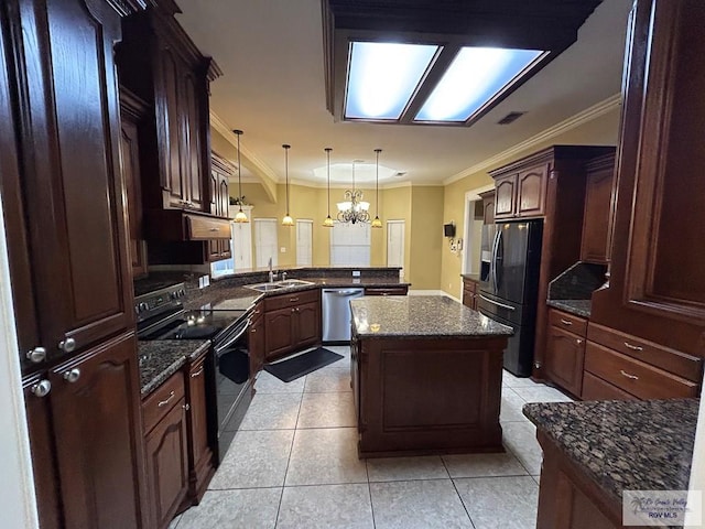 kitchen featuring a kitchen island, pendant lighting, kitchen peninsula, stainless steel appliances, and crown molding