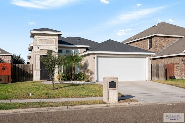 view of front facade featuring a garage and a front yard