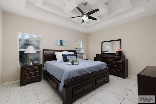 bedroom with a raised ceiling, multiple windows, ceiling fan, and coffered ceiling