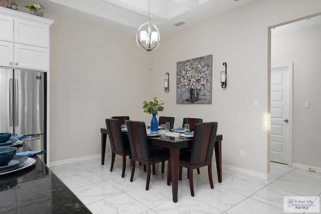 dining space featuring a chandelier