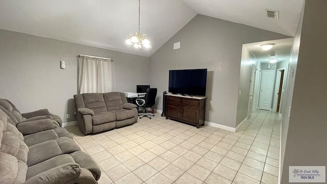 tiled living room featuring a notable chandelier and high vaulted ceiling