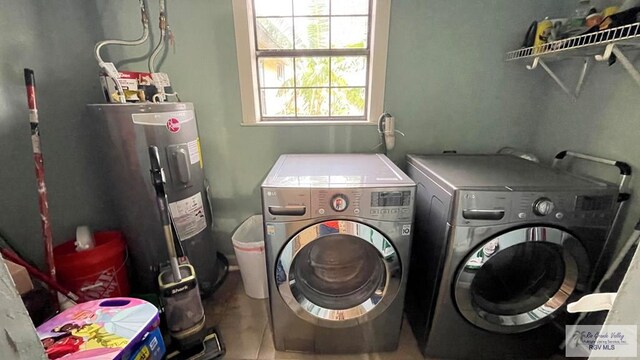 laundry area featuring water heater and washer and dryer