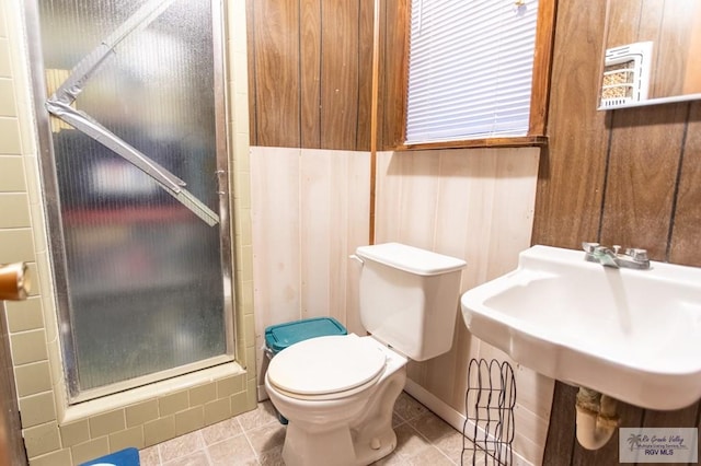 2401 E Austin Ave, Harlingen, TX 78550 - bathroom featuring a stall shower, toilet, and tile patterned floors