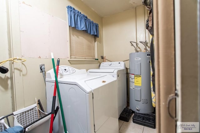 2401 E Austin Ave, Harlingen, TX 78550 - laundry room with water heater, washing machine and dryer, and light tile patterned floors