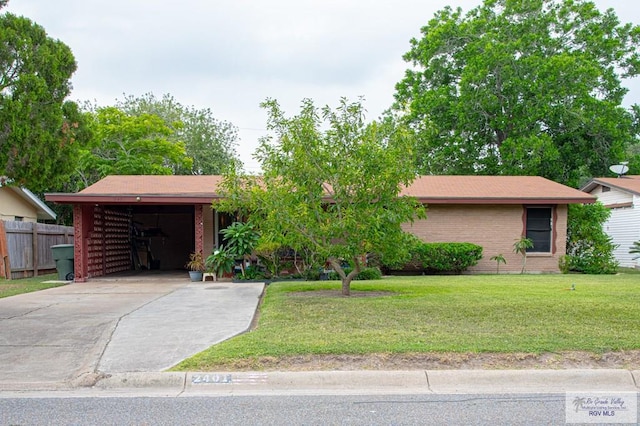 2401 E Austin Ave, Harlingen, TX 78550 - view of front of property featuring driveway and brick siding