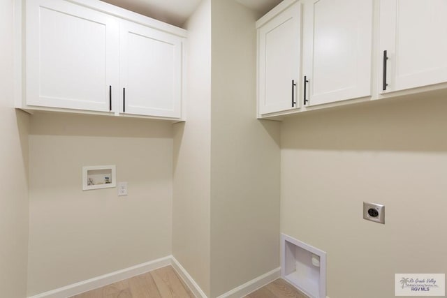 laundry area with washer hookup, light wood-style flooring, electric dryer hookup, baseboards, and cabinet space