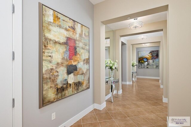 310A Padre Blvd Unit 3102, South Padre Island, TX 78597 - hallway featuring tile patterned flooring and baseboards