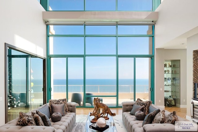 310A Padre Blvd Unit 3102, South Padre Island, TX 78597 - living room featuring a water view and tile patterned flooring