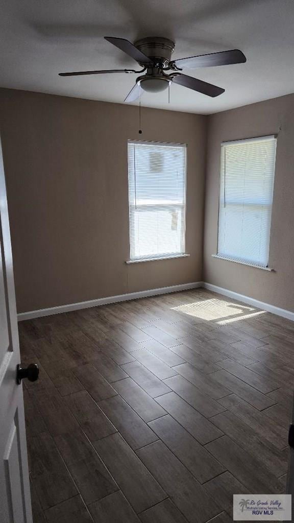 unfurnished room featuring dark hardwood / wood-style floors and ceiling fan