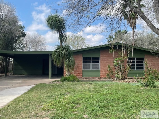 ranch-style house featuring a carport and a front yard