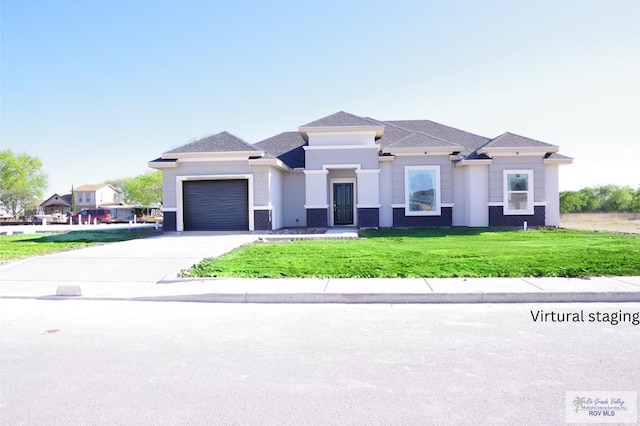 prairie-style home with a front lawn, an attached garage, concrete driveway, and stucco siding