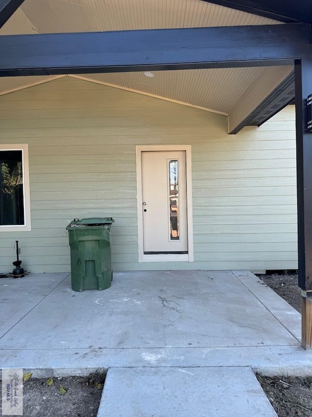 doorway to property with a patio