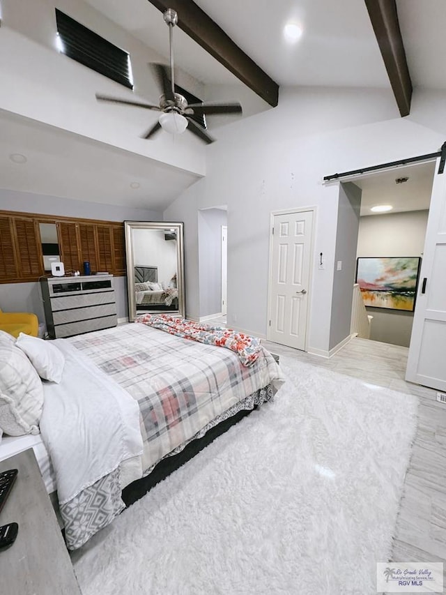 bedroom featuring vaulted ceiling with beams and ceiling fan