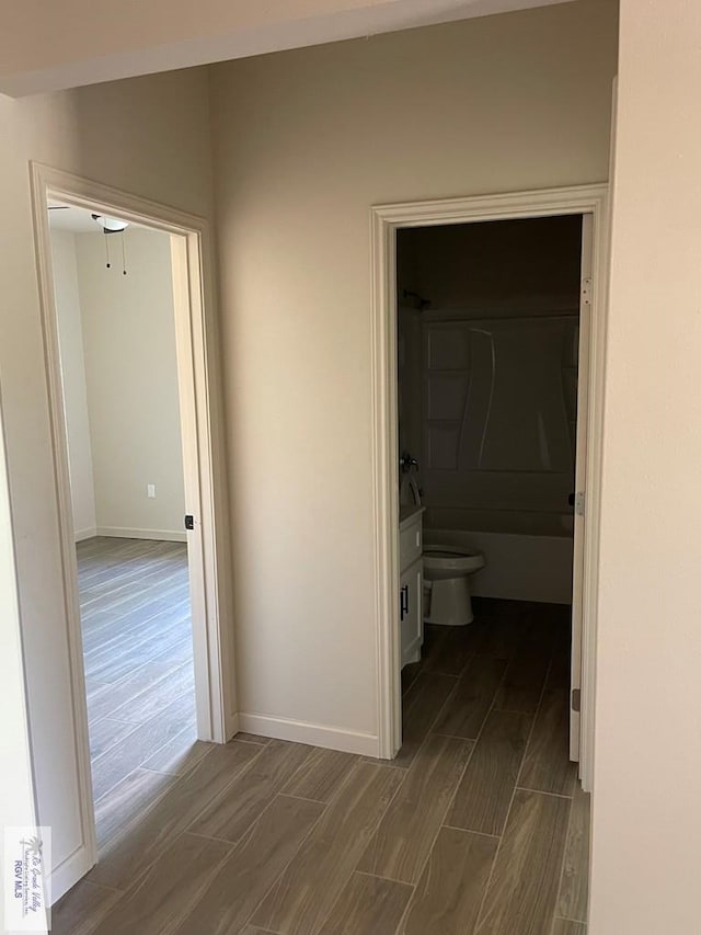 705 W Matz Ave, Harlingen, TX 78550 - hall with wood tiled floors and baseboards