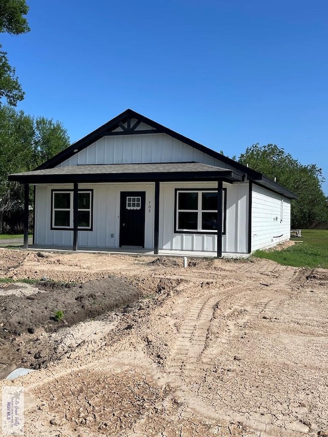 705 W Matz Ave, Harlingen, TX 78550 - view of front of house with covered porch and board and batten siding
