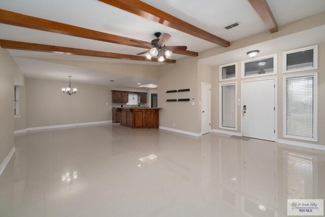 unfurnished living room with ceiling fan with notable chandelier, beam ceiling, and light tile patterned flooring