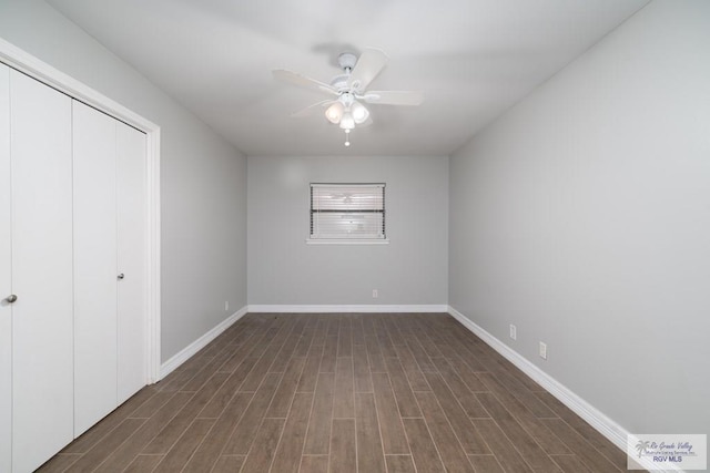 unfurnished bedroom featuring ceiling fan, a closet, and dark hardwood / wood-style floors