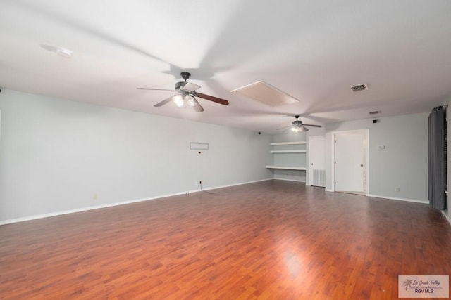 unfurnished living room featuring ceiling fan and dark hardwood / wood-style floors