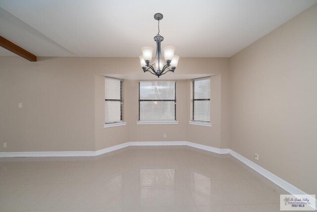 unfurnished room with beamed ceiling, a notable chandelier, and tile patterned flooring