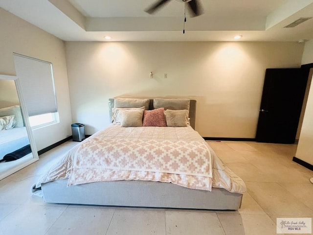 tiled bedroom with ceiling fan