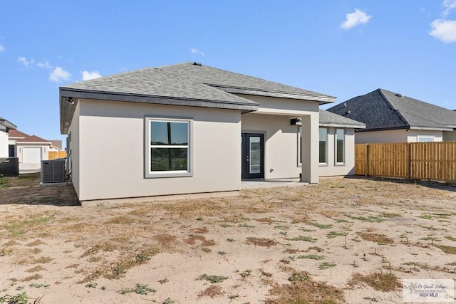 back of property with central AC unit