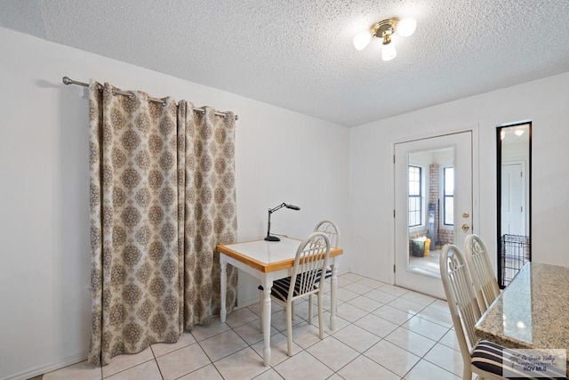 100 Pocahontas Dr Unit 100, Harlingen, TX 78552 - dining space with a textured ceiling and light tile patterned floors
