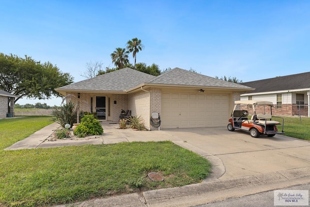 100 Pocahontas Dr Unit 100, Harlingen, TX 78552 - single story home with brick siding, a garage, concrete driveway, and a shingled roof