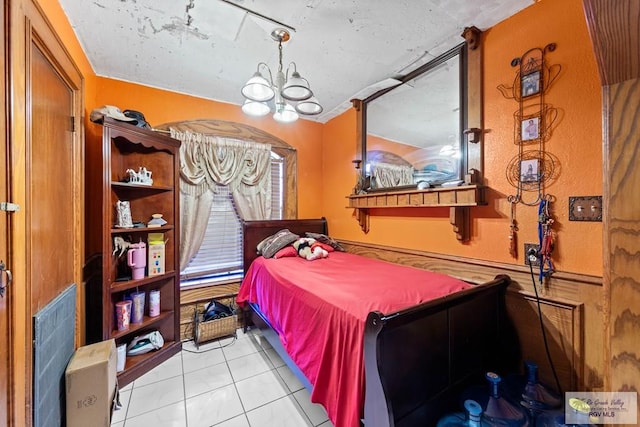 34390 Fm 732, San Benito, TX 78586 - bedroom with light tile patterned floors and a chandelier