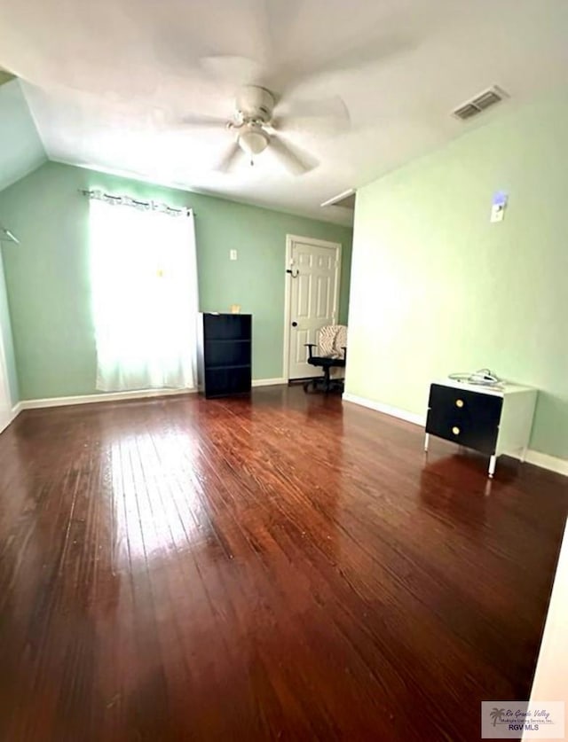 unfurnished living room with visible vents, baseboards, and wood-type flooring