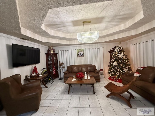 interior space featuring a raised ceiling and a textured ceiling