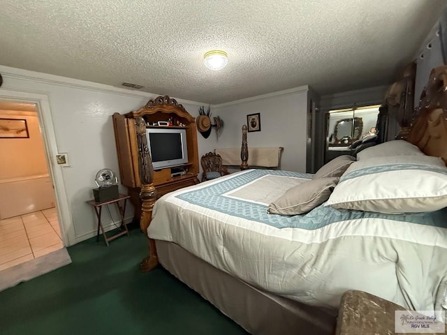 bedroom featuring ornamental molding, a textured ceiling, and dark colored carpet