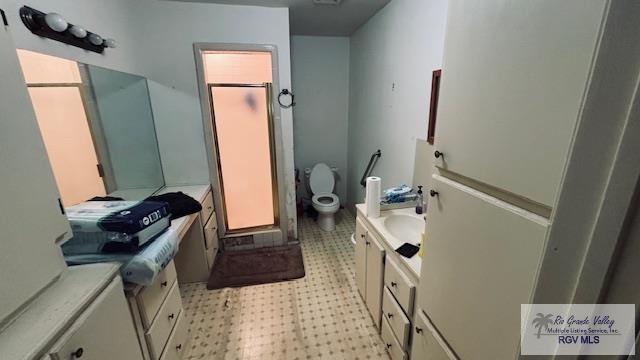 1330 Reagan St Unit 3, San Benito, TX 78586 - bathroom featuring toilet, tile patterned floors, and vanity