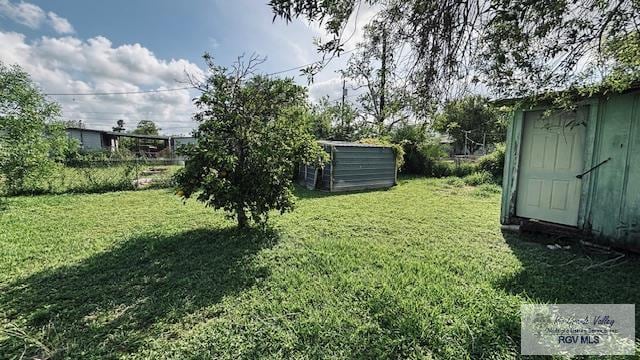 1330 Reagan St Unit 3, San Benito, TX 78586 - view of yard featuring a shed and an outbuilding