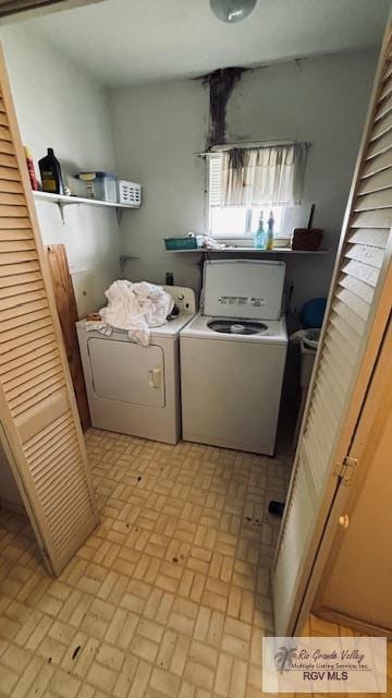 1330 Reagan St Unit 3, San Benito, TX 78586 - clothes washing area featuring washer and dryer, brick patterned floor, and laundry area