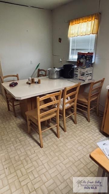 1330 Reagan St Unit 3, San Benito, TX 78586 - dining space with brick patterned floor