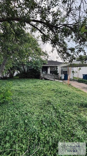 1330 Reagan St Unit 3, San Benito, TX 78586 - view of yard with a carport and driveway