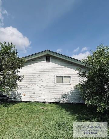 1330 Reagan St Unit 3, San Benito, TX 78586 - view of property exterior featuring a lawn