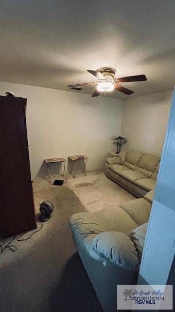 1330 Reagan St Unit 3, San Benito, TX 78586 - living room with visible vents, ceiling fan, and carpet flooring