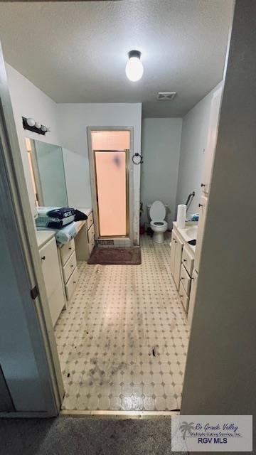1330 Reagan St Unit 3, San Benito, TX 78586 - bathroom with toilet, tile patterned floors, vanity, and visible vents