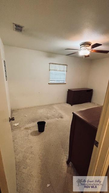 1330 Reagan St Unit 3, San Benito, TX 78586 - carpeted bedroom with a ceiling fan and visible vents