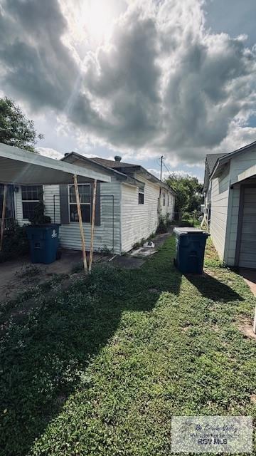 1330 Reagan St Unit 3, San Benito, TX 78586 - view of home's exterior with a yard