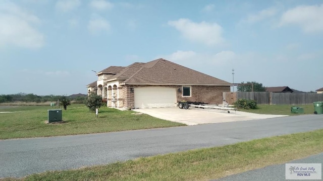 view of property exterior featuring a garage and a yard