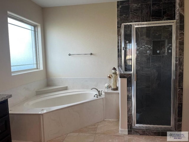 bathroom featuring plus walk in shower and vanity