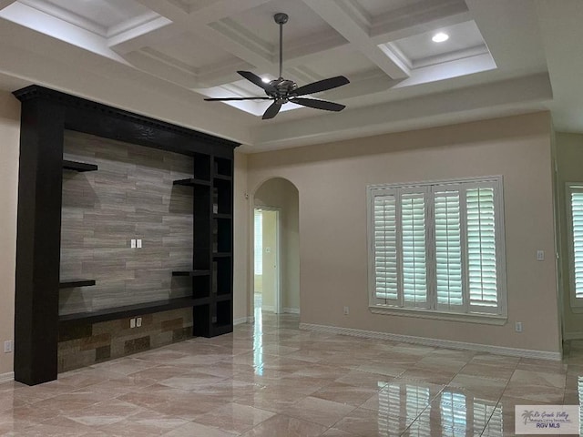 empty room with beam ceiling, ceiling fan, and coffered ceiling