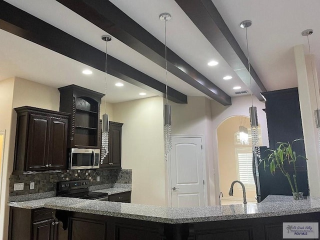 kitchen with light stone countertops, backsplash, dark brown cabinets, stainless steel appliances, and decorative light fixtures