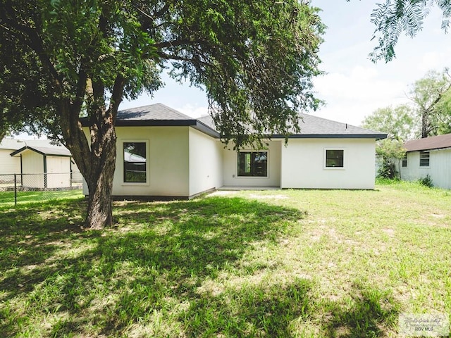 23100 Hidalgo Ave, Harlingen, TX 78552 - rear view of house with stucco siding