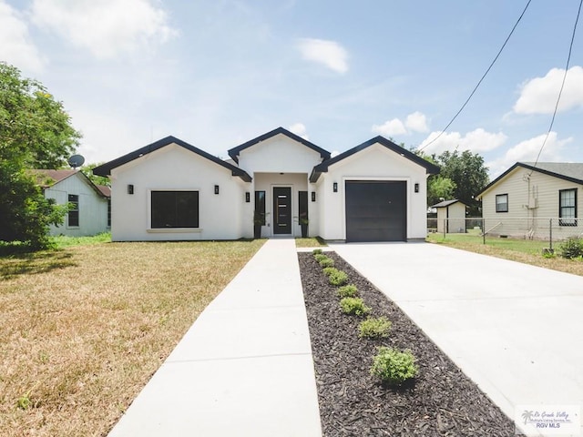 23100 Hidalgo Ave, Harlingen, TX 78552 - modern farmhouse style home featuring driveway, a garage, and stucco siding