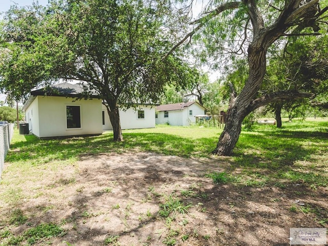 23100 Hidalgo Ave, Harlingen, TX 78552 - view of green lawn with central air condition unit